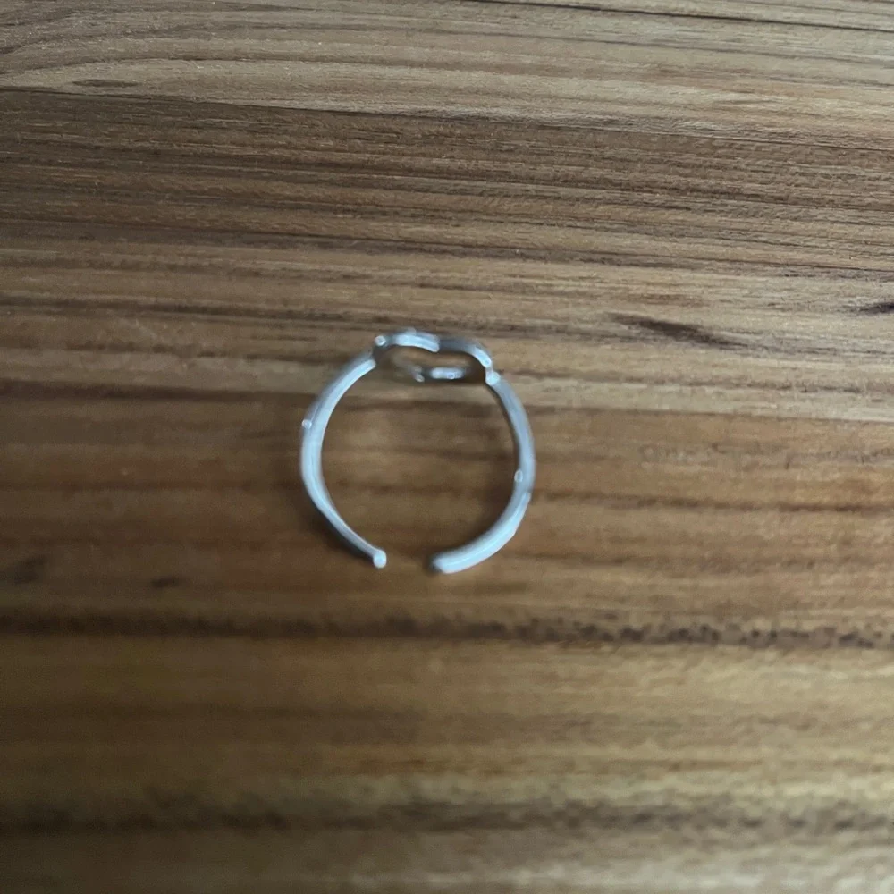 New silver tone heart shaped ring adjustable band one size fits most